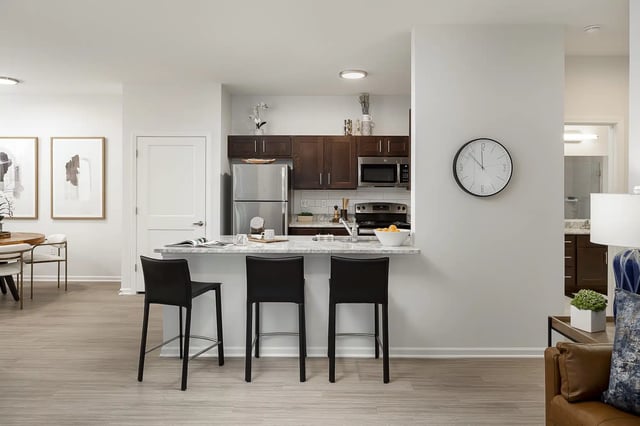 Bar stools at kitchen counter with appliances kitchen at Frontgate in Louisville Student Accommodation