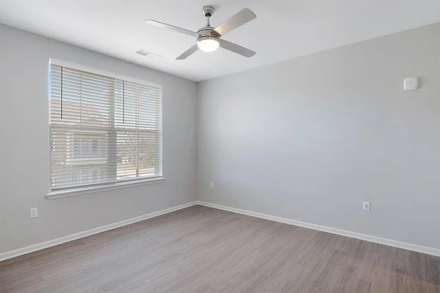 Ceiling fan blinds light grey floor bedroom at The Belltower in Louisville Student Accommodation