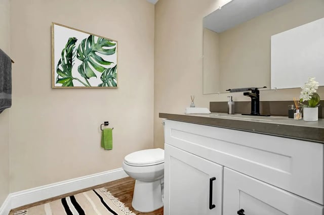 Toilet sink painting towel rack bathroom at Flats on Elk in Glendale Student Accommodation