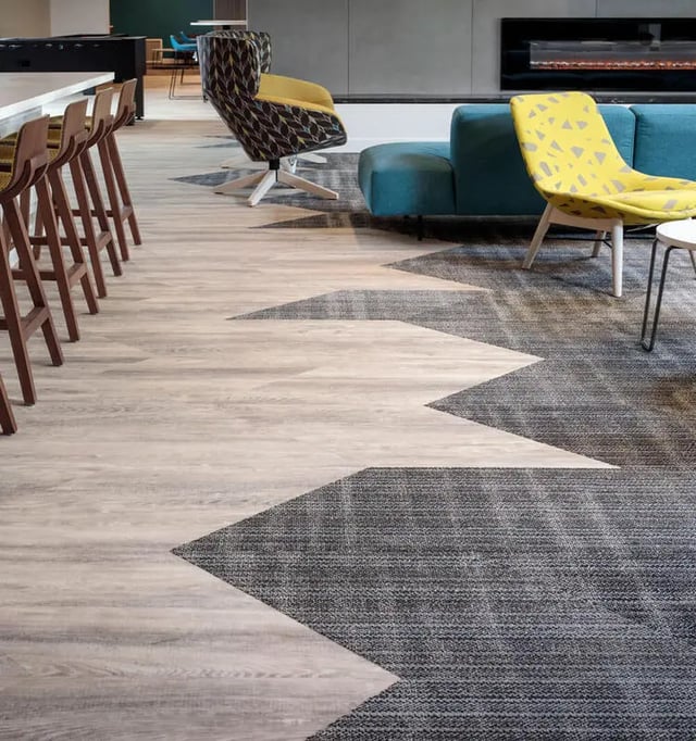 Bar stools by counter and seating area living room at M @ College in San Diego Student Accommodation