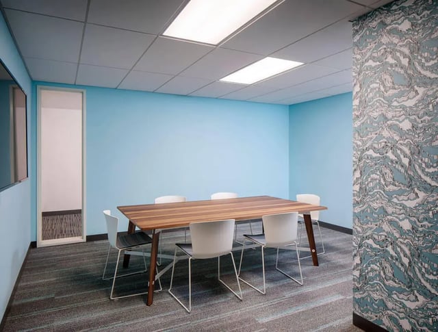 Conference table with chairs study area at M @ College in San Diego Student Accommodation