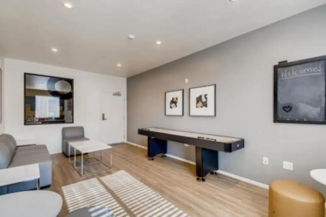 Shuffleboard table with seating and art Living room at Prisma in San Diego Student Accommodation