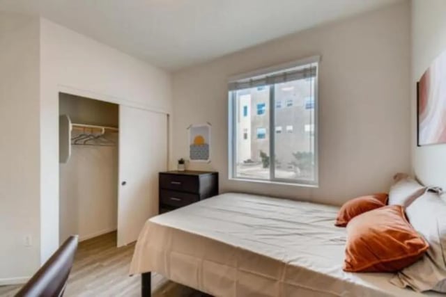 Bed dresser closet sliding doors bedroom at Prisma in San Diego Student Accommodation
