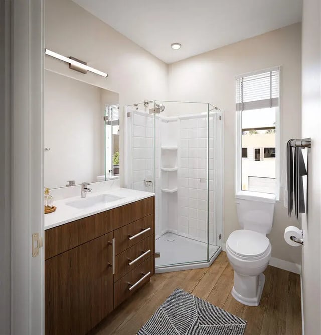 Modern bathroom vanity toilet and glass shower bathroom at The Cove in Goleta Student Accommodation