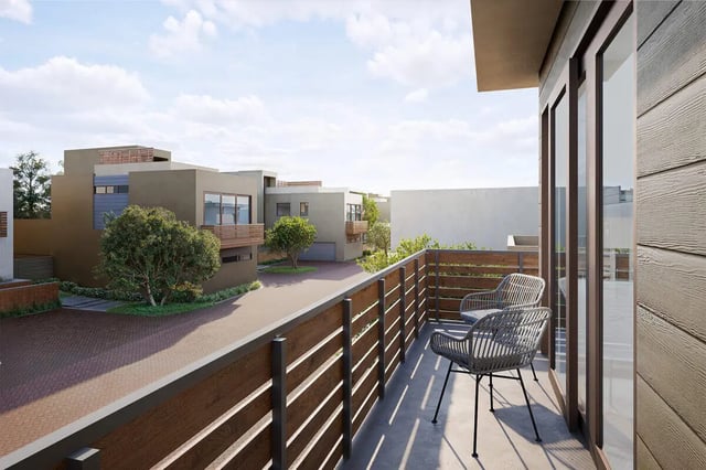 Chairs on balcony overlooking houses exterior at The Cove in Goleta Student Accommodation