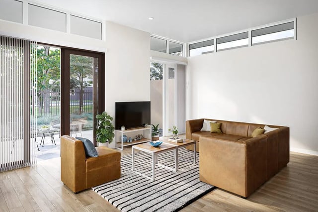 Brown sectional couch coffee tables TV living room at The Cove in Goleta Student Accommodation