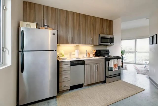 Stainless steel refrigerator dishwasher stove kitchen at The Loop in Isla Vista Student Accommodation