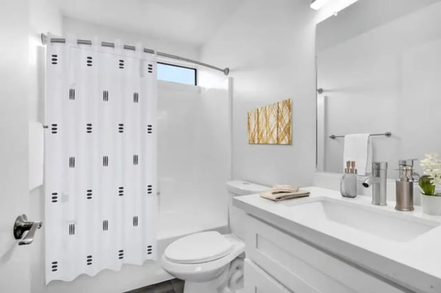 Shower curtain toilet sink and vanity bathroom at Valleywood in Los Angeles Student Accommodation