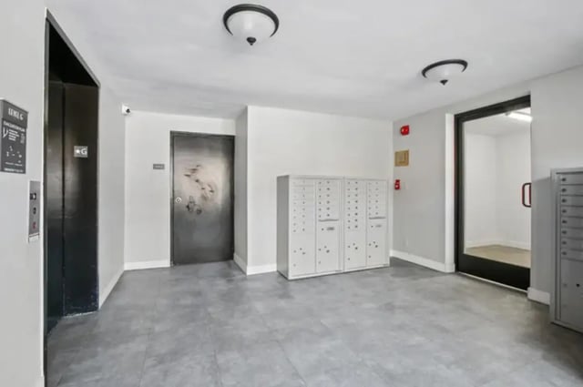 Mailboxes elevator door and entrance hall hallway at Valleywood in Los Angeles Student Accommodation