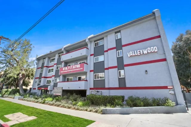Valleywood building with balconies windows banners exterior at Valleywood in Los Angeles Student Accommodation