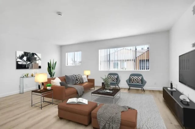 Brown couch two chairs coffee table living room at Valleywood in Los Angeles Student Accommodation