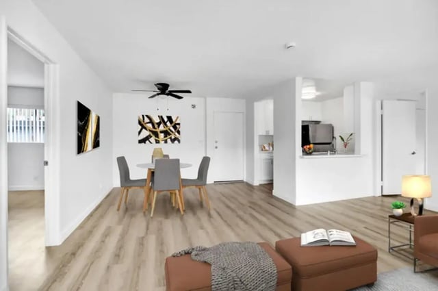 Dining table chairs artwork kitchen living room exterior at Valleywood in Los Angeles Student Accommodation