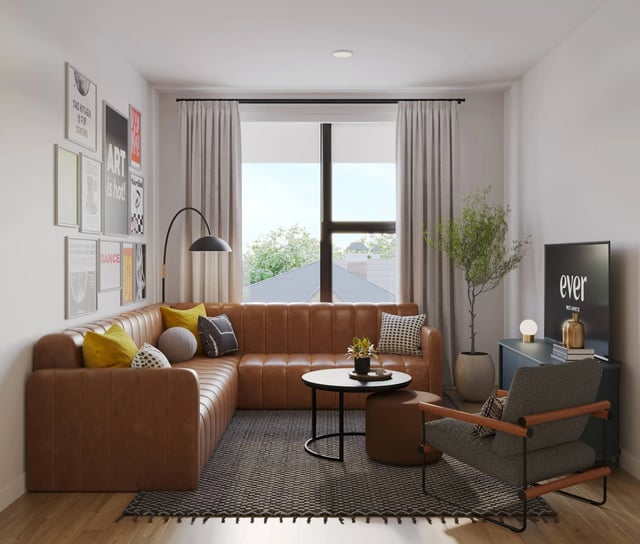 Brown sectional sofa rug coffee table arm chair living room at Ever West Lafayette in West Lafayette Student Accommodation