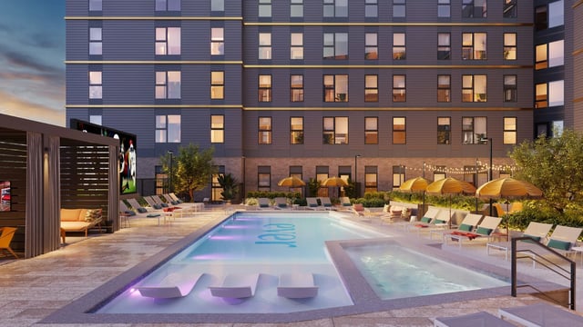 Pool with in-water loungers spa and umbrellas exterior at Ever West Lafayette in West Lafayette Student Accommodation
