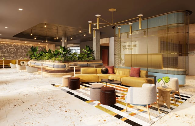 Yellow sofa with ottomans and chairs lounge area at Ever West Lafayette in West Lafayette Student Accommodation