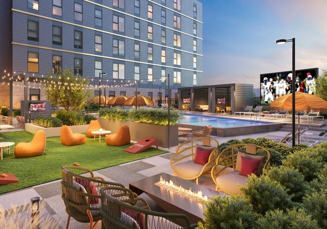 Pool cabanas chairs fire pit beanbags lawn games exterior at Ever West Lafayette in West Lafayette Student Accommodation