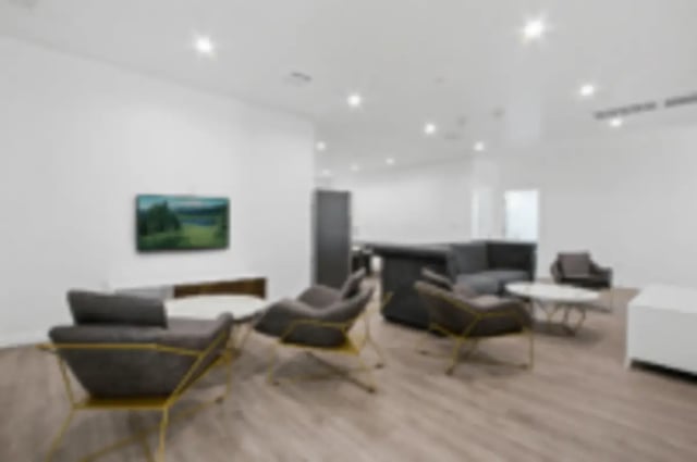 Chairs couches television modern living area living room at Heritage 2831 in Los Angeles Student Accommodation