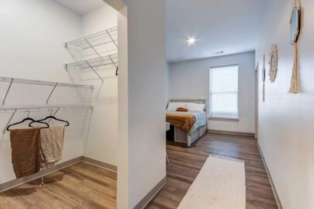 Walk-in closet with shelves and hangers bedroom at The Helmsman in Savannah Student Accommodation