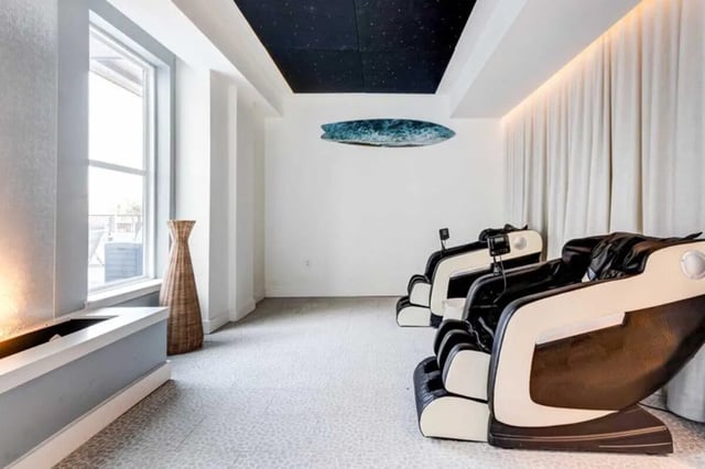 Massage chairs window and vase common area at The Helmsman in Savannah Student Accommodation