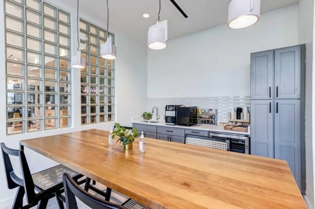 Wood table coffee maker cabinets kitchen area at The Helmsman in Savannah Student Accommodation
