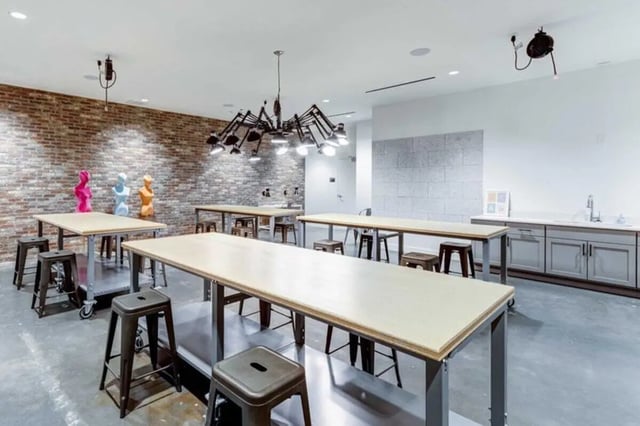 Workspaces with tables and stools creative space at The Helmsman in Savannah Student Accommodation