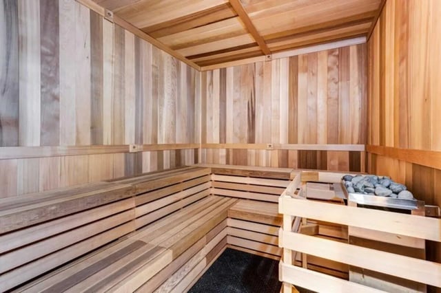 Wooden sauna with benches and heater Sauna Room at The Helmsman in Savannah Student Accommodation