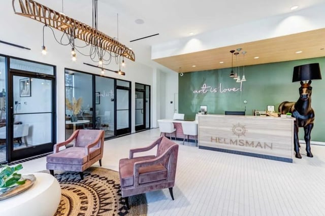 Reception area with two plush chairs lobby at The Helmsman in Savannah Student Accommodation
