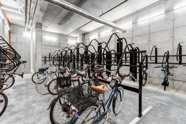 Bicycles in storage rack concrete walls Image Area at The Helmsman in Savannah Student Accommodation