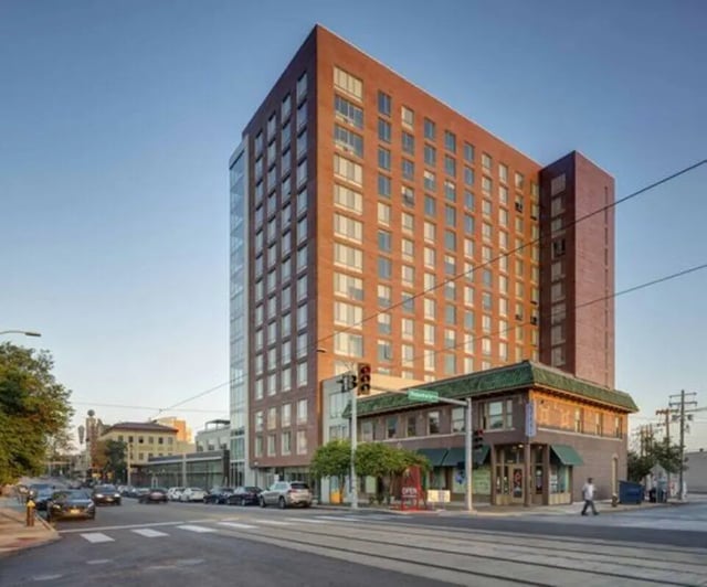 Tall brick building with glass facade exterior at Everly On The Loop in St. Louis Student Accommodation