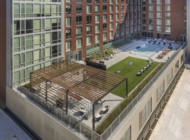 Rooftop pool lounge area and grass exterior at Everly On The Loop in St. Louis Student Accommodation