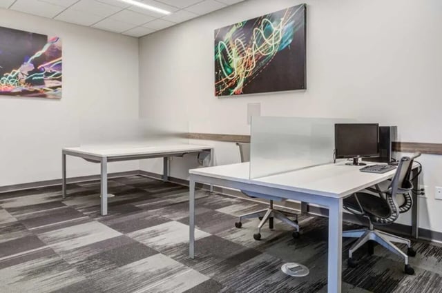 Two desks with computers and chairs study area at Everly On The Loop in St. Louis Student Accommodation