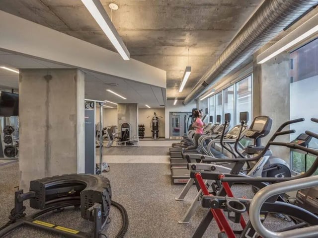 Treadmills elliptical machines weights tire flip gym at Everly On The Loop in St. Louis Student Accommodation