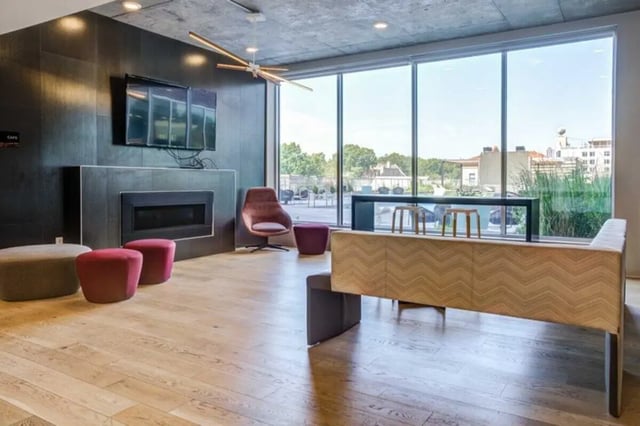 Fireplace tv stools and seating living room at Everly On The Loop in St. Louis Student Accommodation