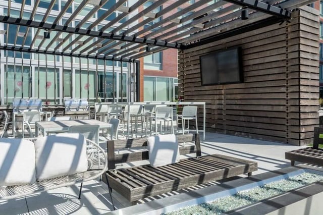 Outdoor grills tables and lounge seating exterior at Everly On The Loop in St. Louis Student Accommodation