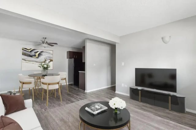Dining area with table chairs and kitchen living room at Aviator Apartments in Colorado Springs Student Accommodation