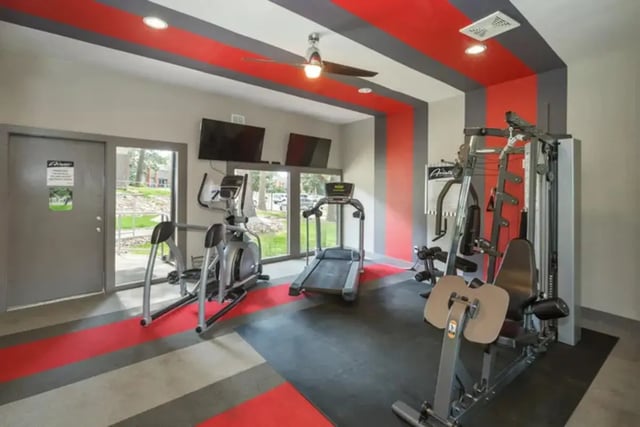Gym equipment with treadmills elliptical and weight machine gym area at Aviator Apartments in Colorado Springs Student Accommodation