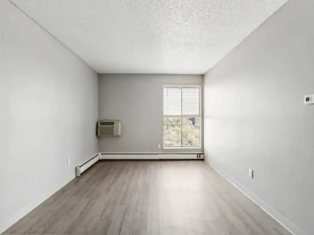 Empty room with window AC heating unit living room at Chestnut Springs Apartments in Colorado Springs Student Accommodation