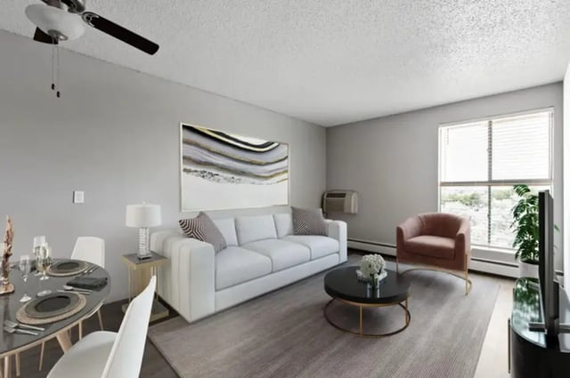 Sofa coffee table chairs and dining table living room at Chestnut Springs Apartments in Colorado Springs Student Accommodation