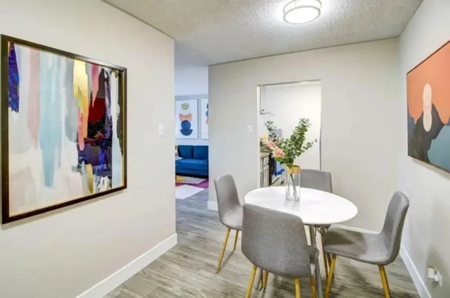 Round dining table with chairs modern art dining room at Copper Chase Apartments in Colorado Springs Student Accommodation