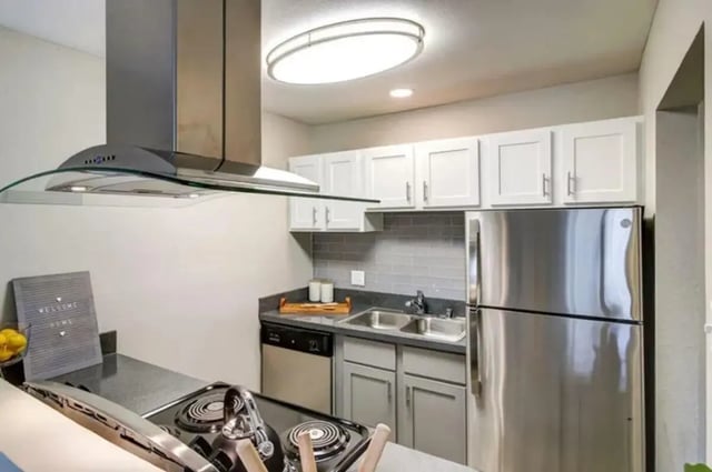 Stainless steel refrigerator oven dishwasher kitchen. at Flight at Lowry in Aurora Student Accommodation