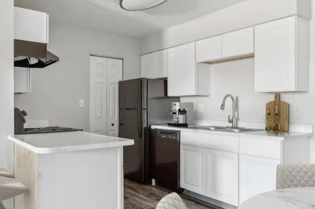 White cabinets refrigerator oven and island kitchen at Lincoln Springs Apartments in Colorado Springs Student Accommodation