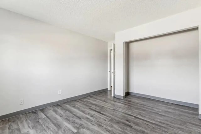 Empty room with wood floor and closet living room at Lincoln Springs Apartments in Colorado Springs Student Accommodation