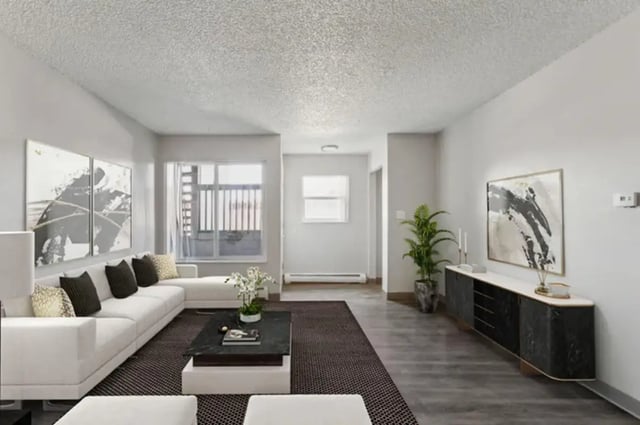 White sectional sofa coffee table art living room at Lincoln Springs Apartments in Colorado Springs Student Accommodation