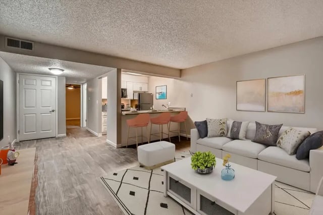 White couch coffee table kitchen bar living room at Newgate in Wheat Ridge Student Accommodation