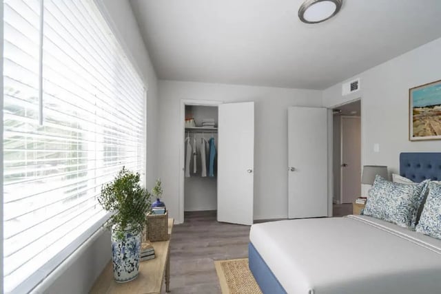 Bed closet doors plant and picture bedroom at Newport Square Apartments in Colorado Springs Student Accommodation