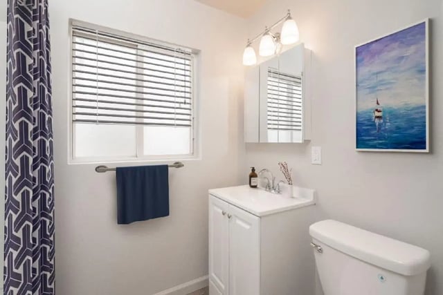 Vanity sink medicine cabinet toilet towel bathroom at Newport Square Apartments in Colorado Springs Student Accommodation
