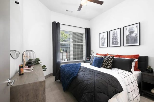 Bed with black white bedding artwork dresser bedroom at RYE SoBo in Denver Student Accommodation