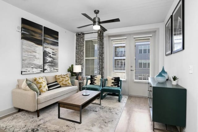 Sofa coffee table artwork and chairs living room at RYE SoBo in Denver Student Accommodation
