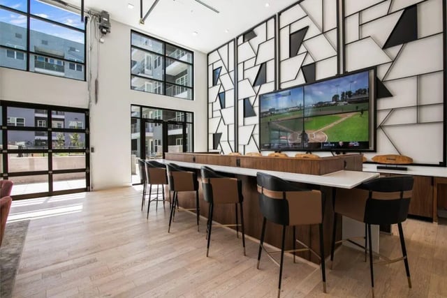 Bar seating in front of TV living room at RYE SoBo in Denver Student Accommodation
