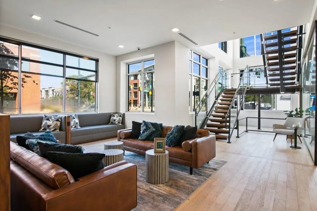Leather sofas striped tables modern stairs living room at RYE SoBo in Denver Student Accommodation